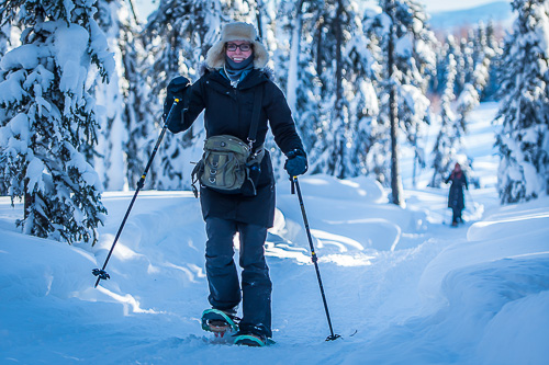 young woman snowshoeing