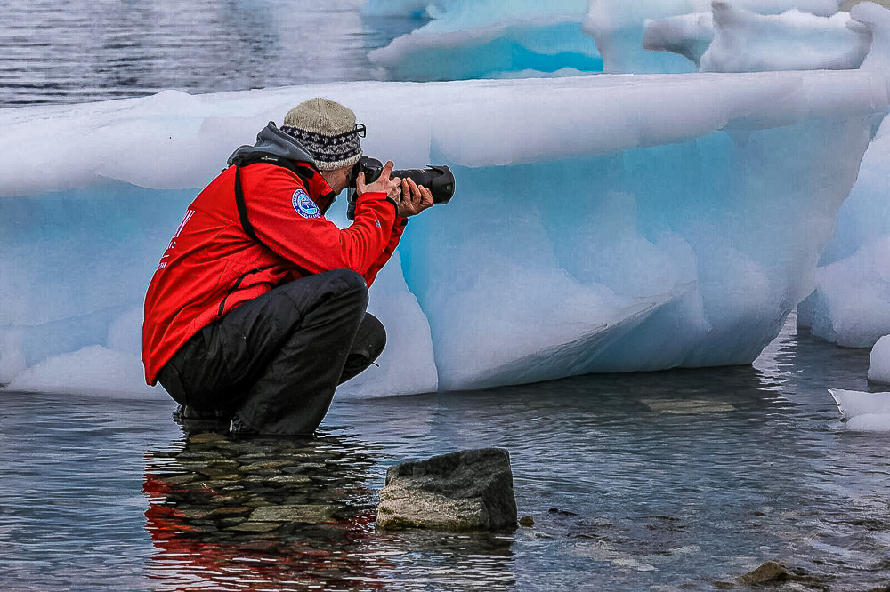 man ice Antarctica photographer